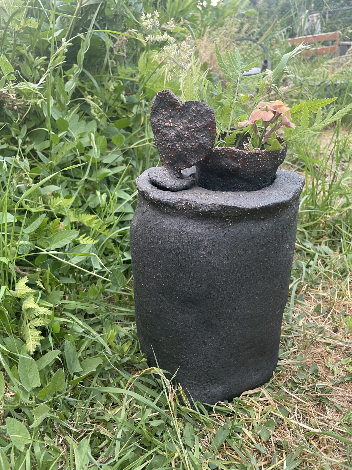 Black Urn, with heart stopper and integrated vase.